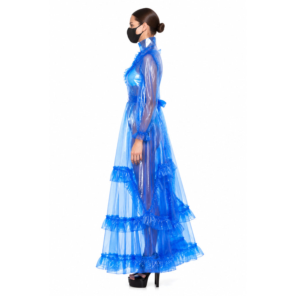 Blue sissy maid dress with ruffled PVC overlay, high collar, and tiered skirt, worn with black heels