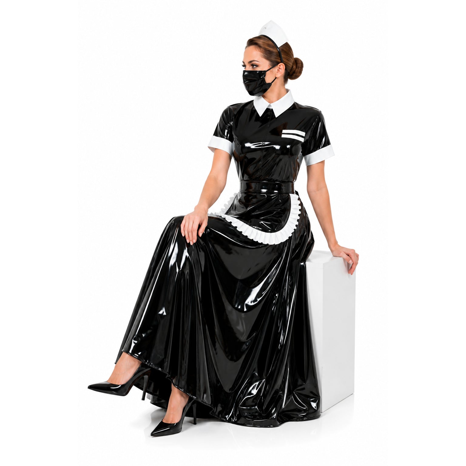 Shiny black sissy maid dress with white trim, apron, and cap, worn with heels and mask