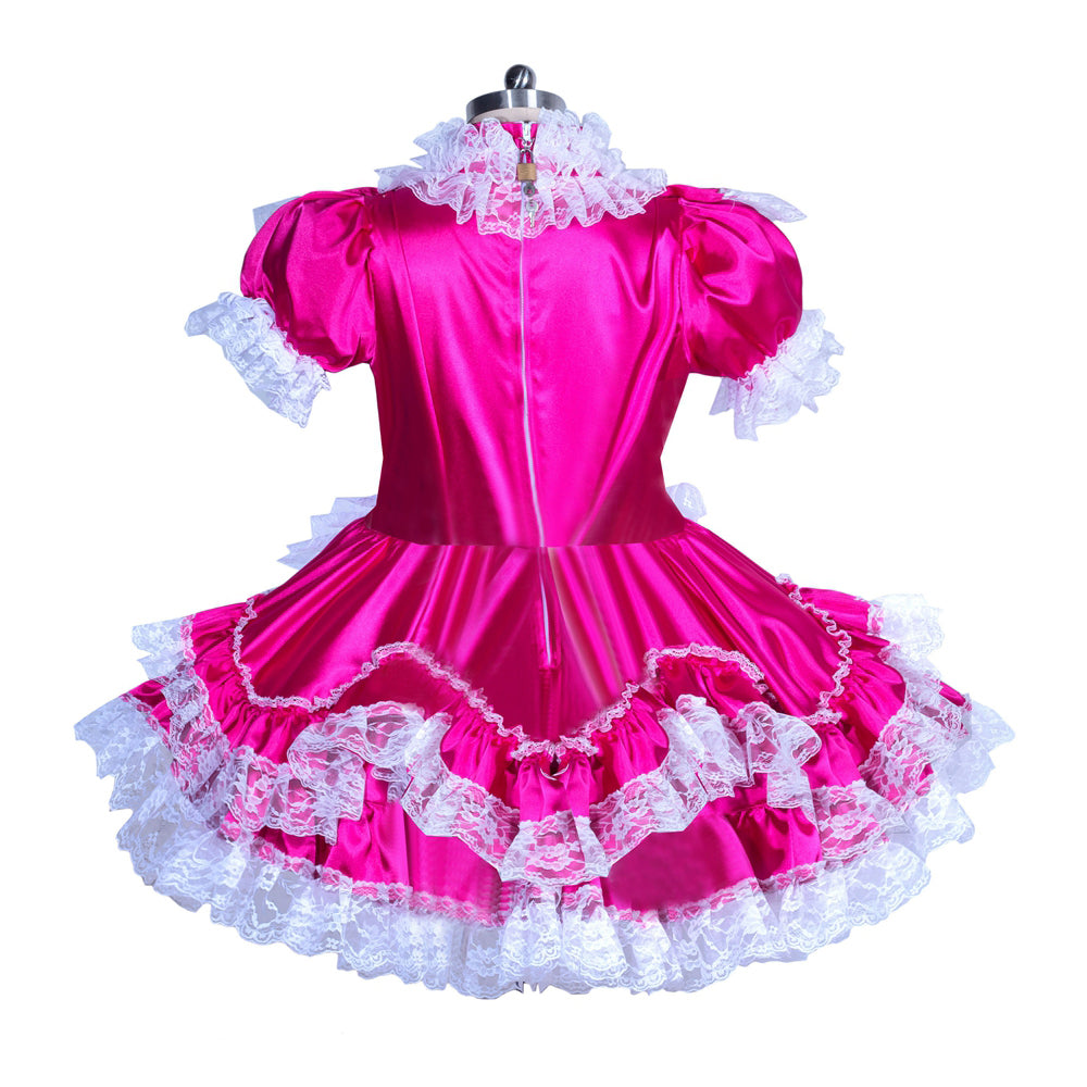 Pink sissy maid dress with white lace trim, puffed sleeves, and ruffled skirt on mannequin