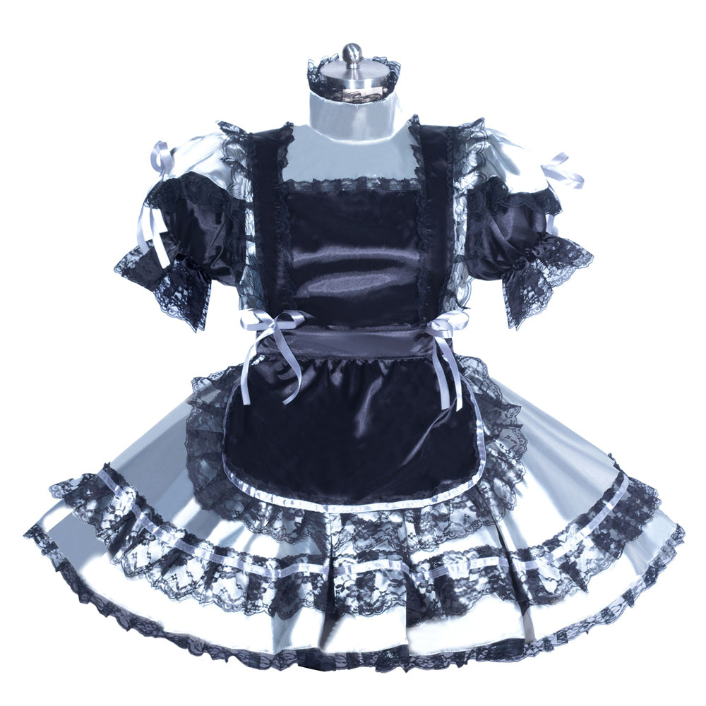 Black and white sissy maid dress with lace trim, ruffles, and satin apron on mannequin