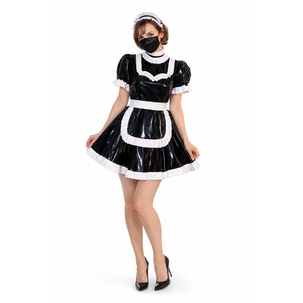 Black PVC sissy maid dress with white ruffles, apron, and headband, paired with heels