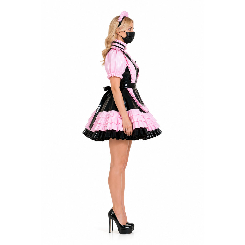 Pink and black sissy maid dress with ruffles, PVC accents, and matching headband, styled with high heels.