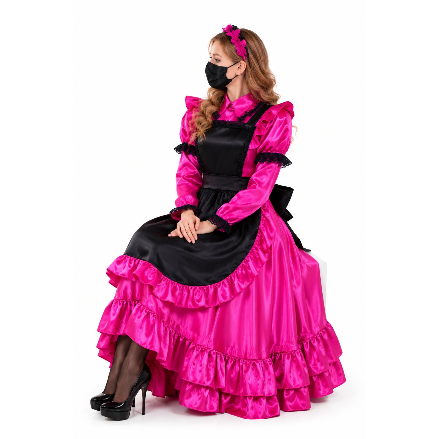 Pink and black sissy maid dress with ruffles, lace trim, and apron, worn with heels and headband