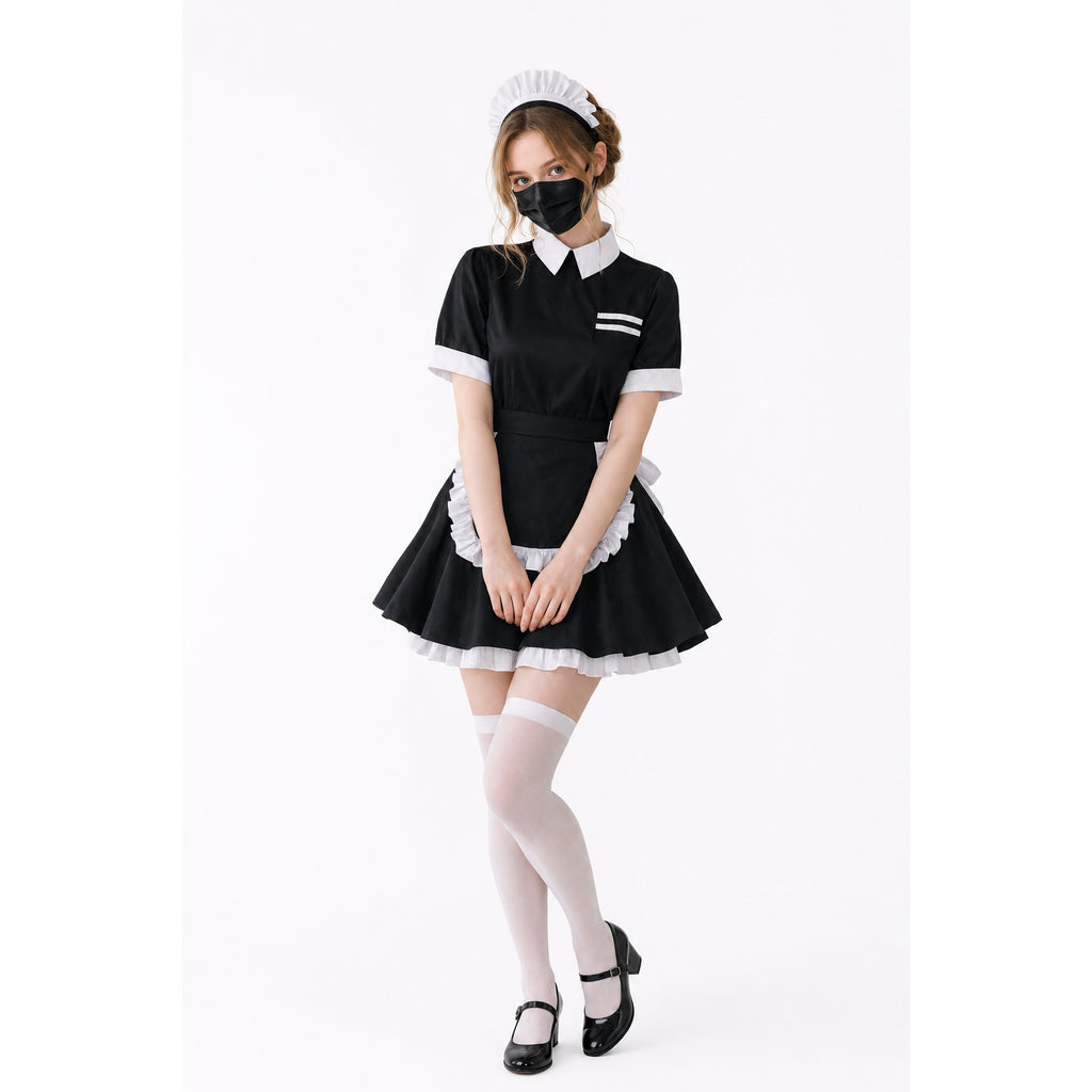 Black and white sissy maid dress with ruffled apron, collar, and headpiece, paired with white stockings and heels