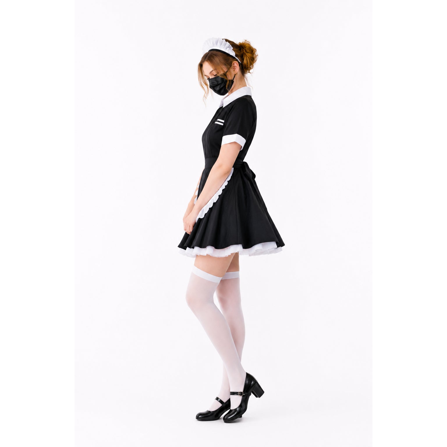 Black and white maid dress with frills, white stockings, and heels, styled for elegant costume fashion.