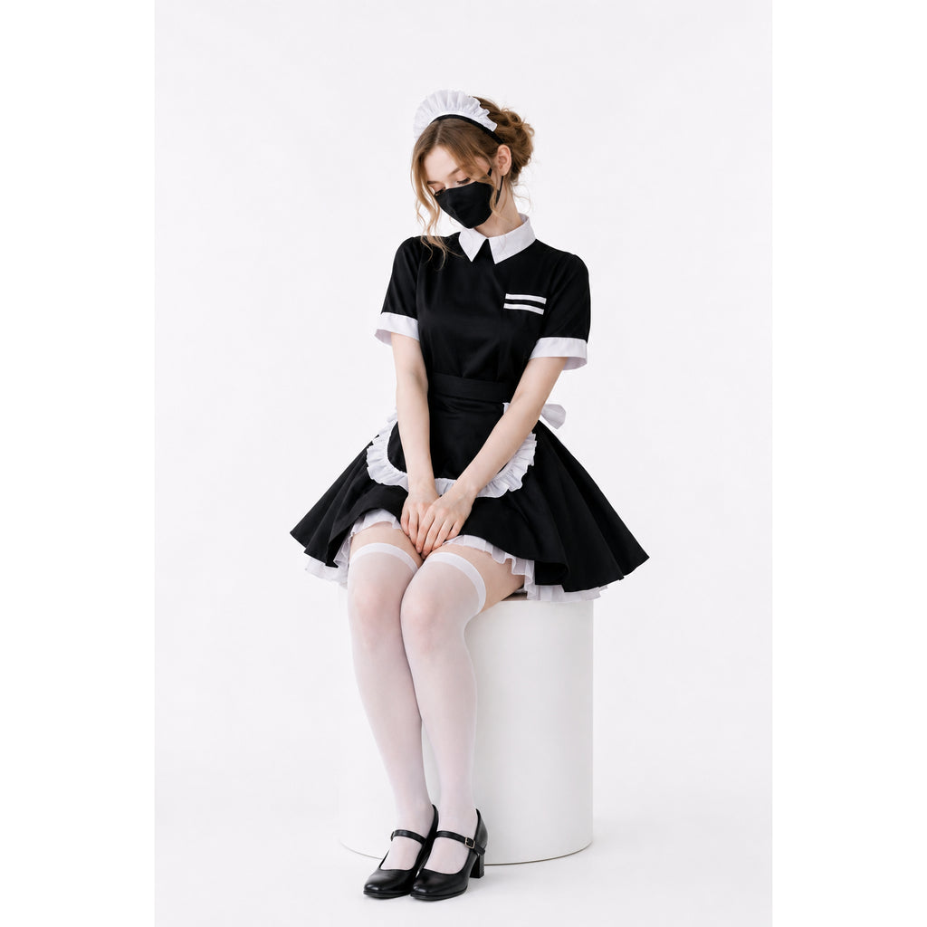 Sissy maid dress with black and white ruffled apron, white stockings, and Mary Jane shoes