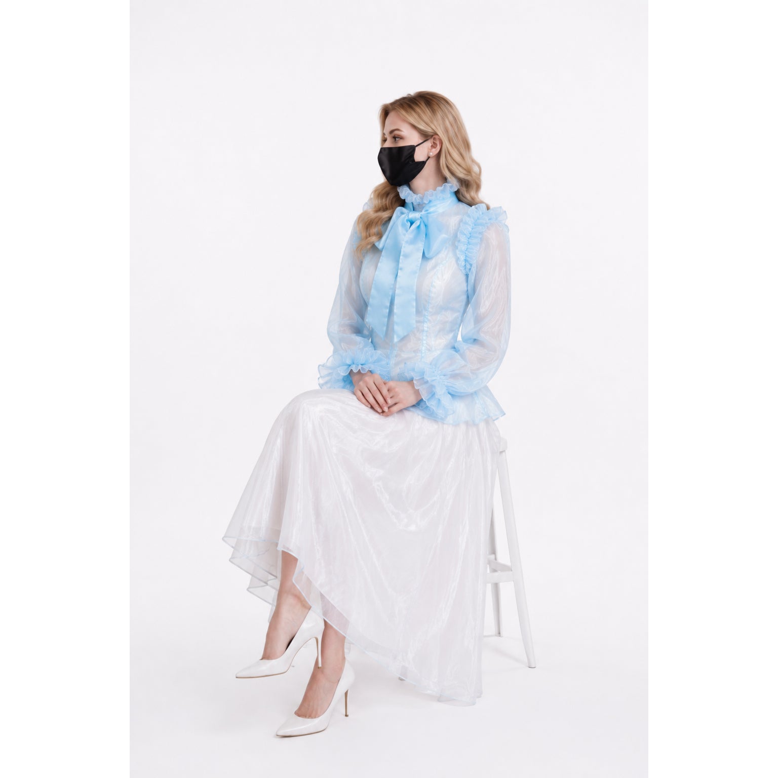 Elegant sissy maid dress with sheer blue blouse, ruffles, and white skirt, paired with white heels.