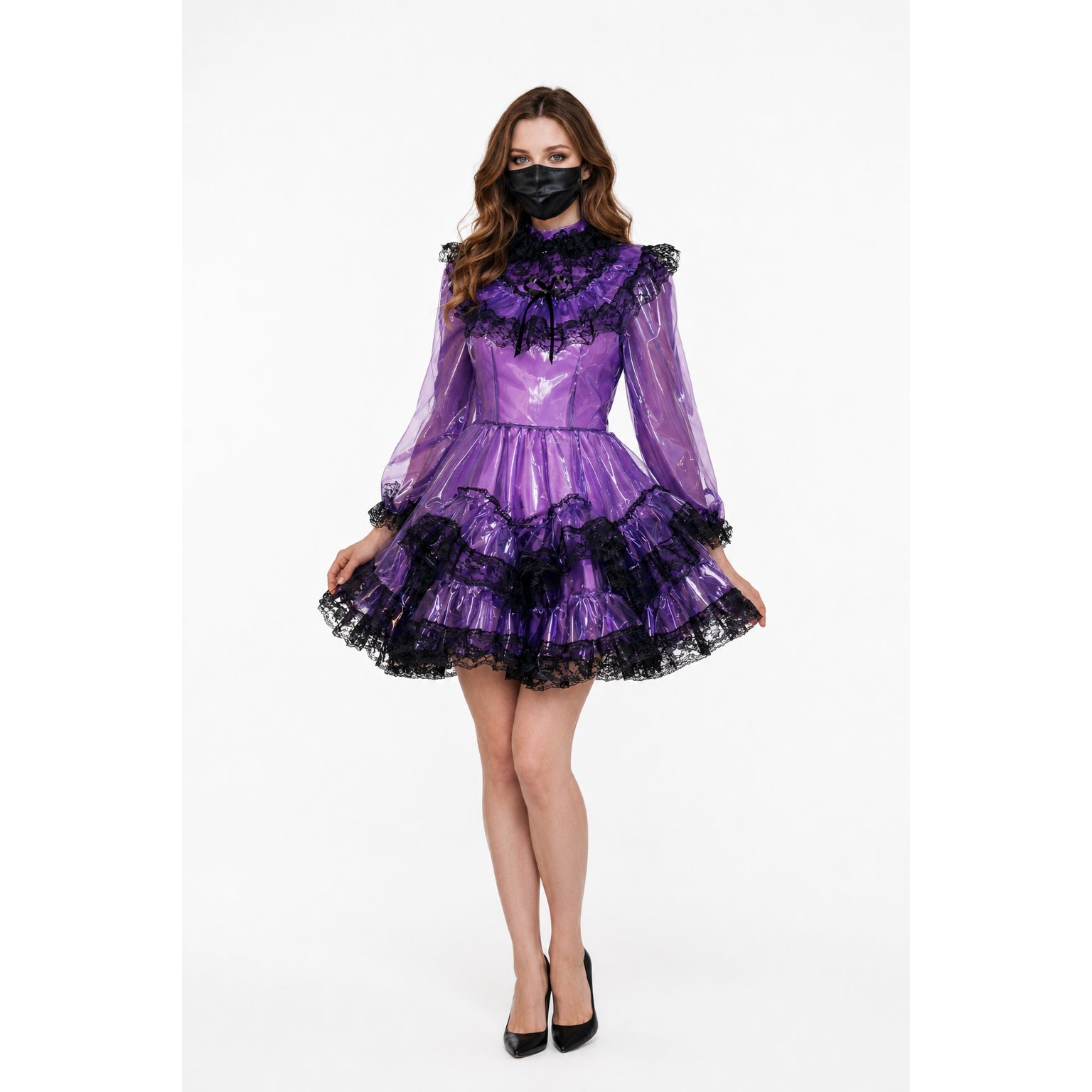 Purple PVC sissy maid dress with black lace trim, ruffled skirt, and long sleeves, paired with black heels.