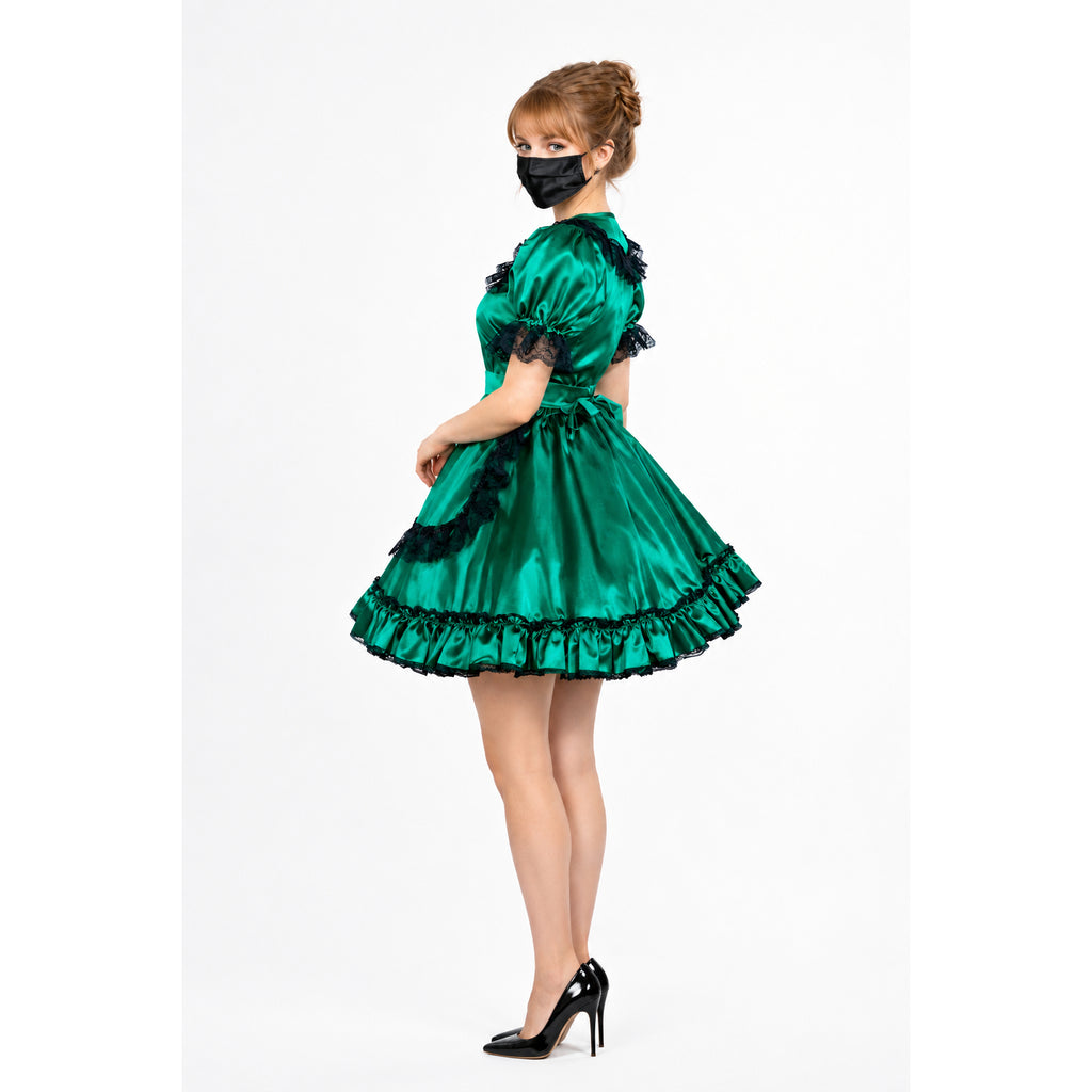 Emerald green sissy maid dress with black lace trim and ruffles, paired with black heels.