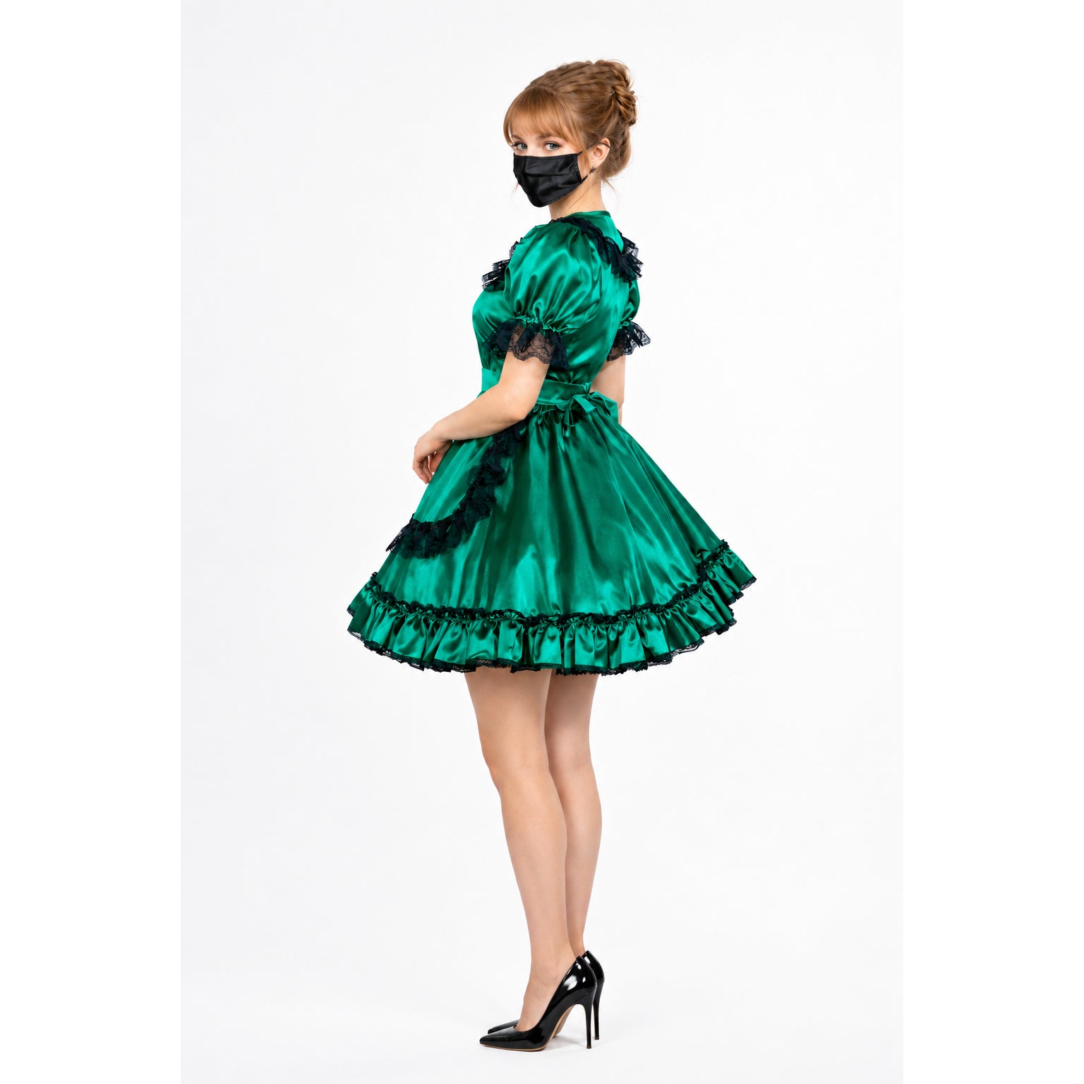 Emerald green sissy maid dress with black lace trim and ruffles, paired with black heels.