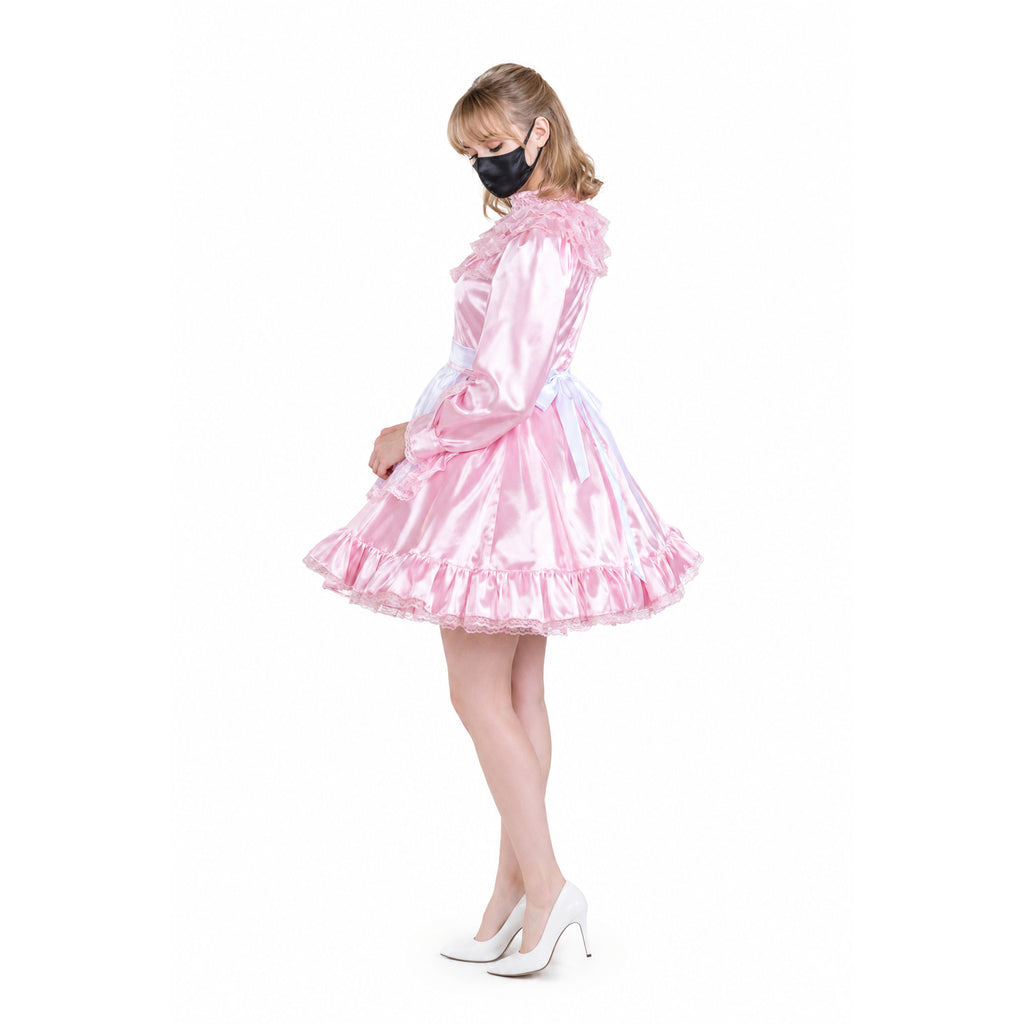 Pink satin sissy maid dress with ruffles, lace trim, and white heels, styled for elegant costume fashion.