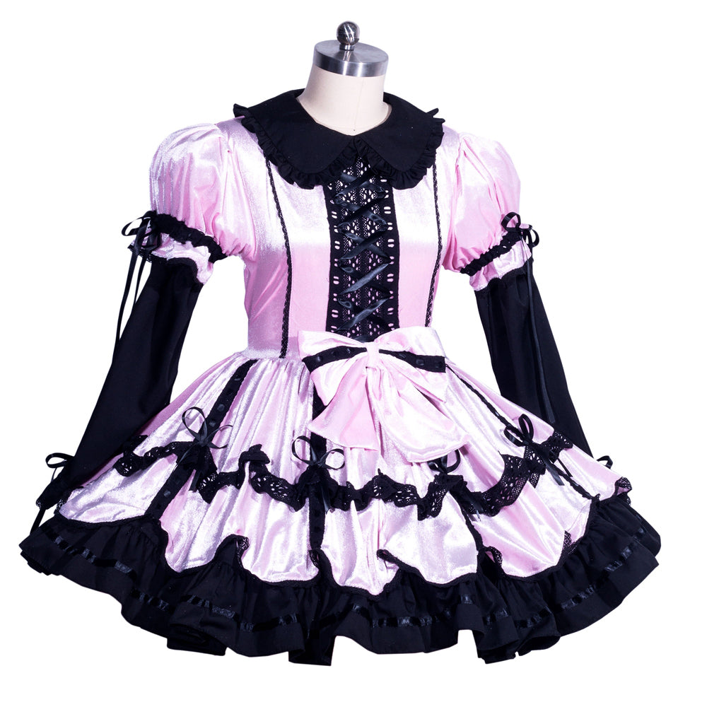 Pink and black sissy maid dress with lace-up corset, ruffles, and bow detail on mannequin