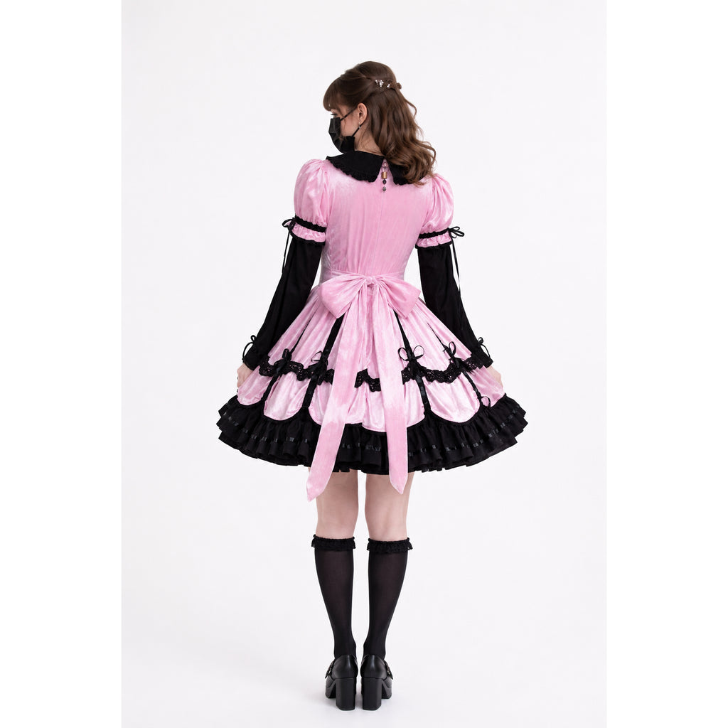 Pink sissy maid dress with black lace, bow, and ruffles, shown from back