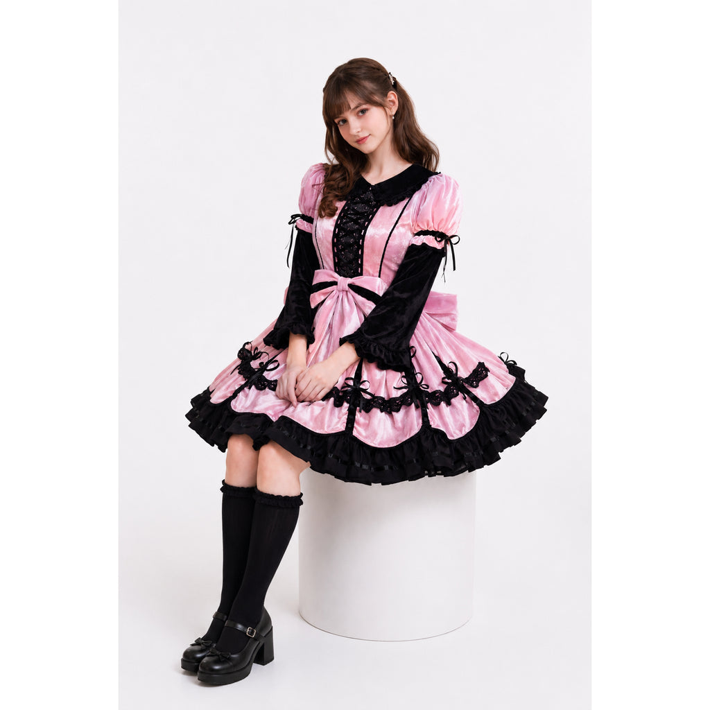 Pink and black sissy maid dress with lace, ruffles, and bow detail, styled with knee-high socks and heels