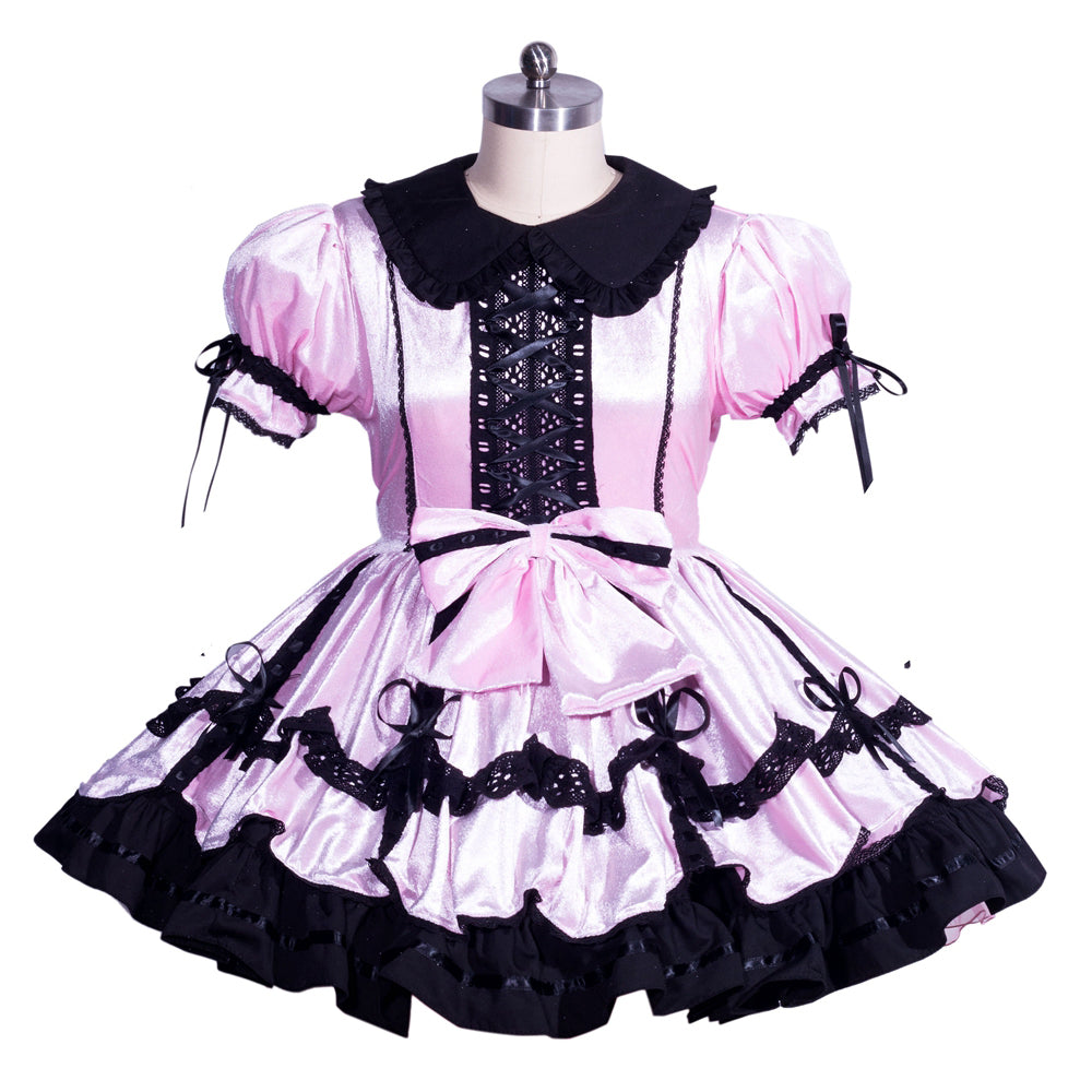 Pink and black sissy maid dress with lace-up front, ruffles, and bow detail on mannequin