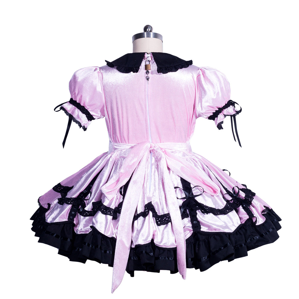 Pink sissy maid dress with black lace trim, ruffles, and back bow on mannequin
