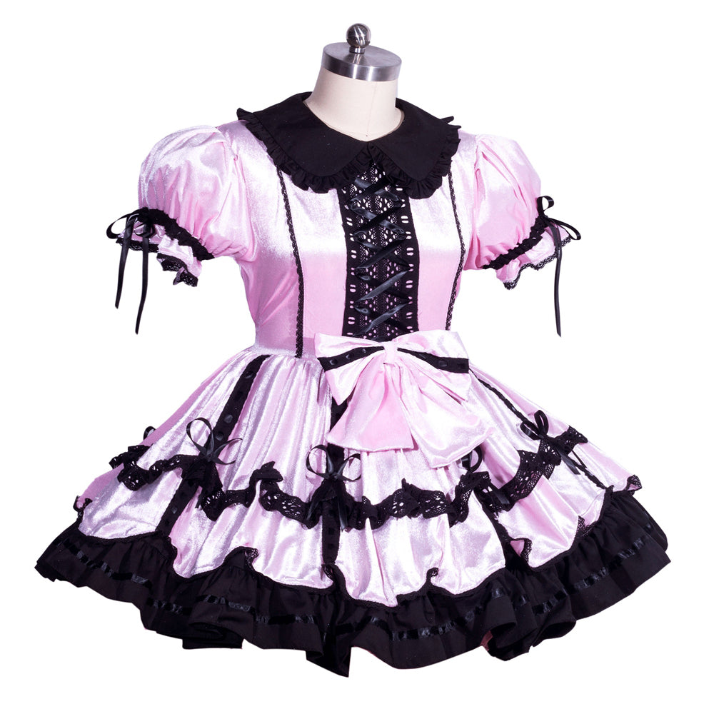 Pink and black sissy maid dress with lace, bows, and ruffles on mannequin