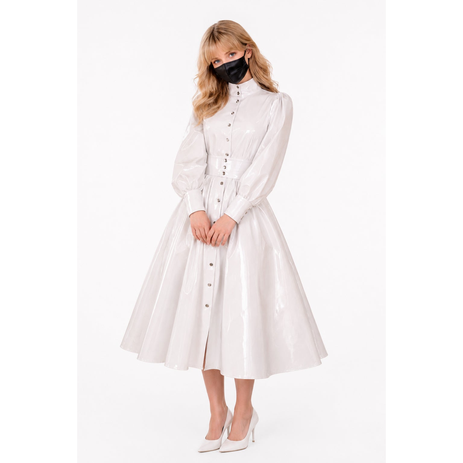 White PVC sissy maid dress with button front, puffed sleeves, and flared skirt, paired with matching heels