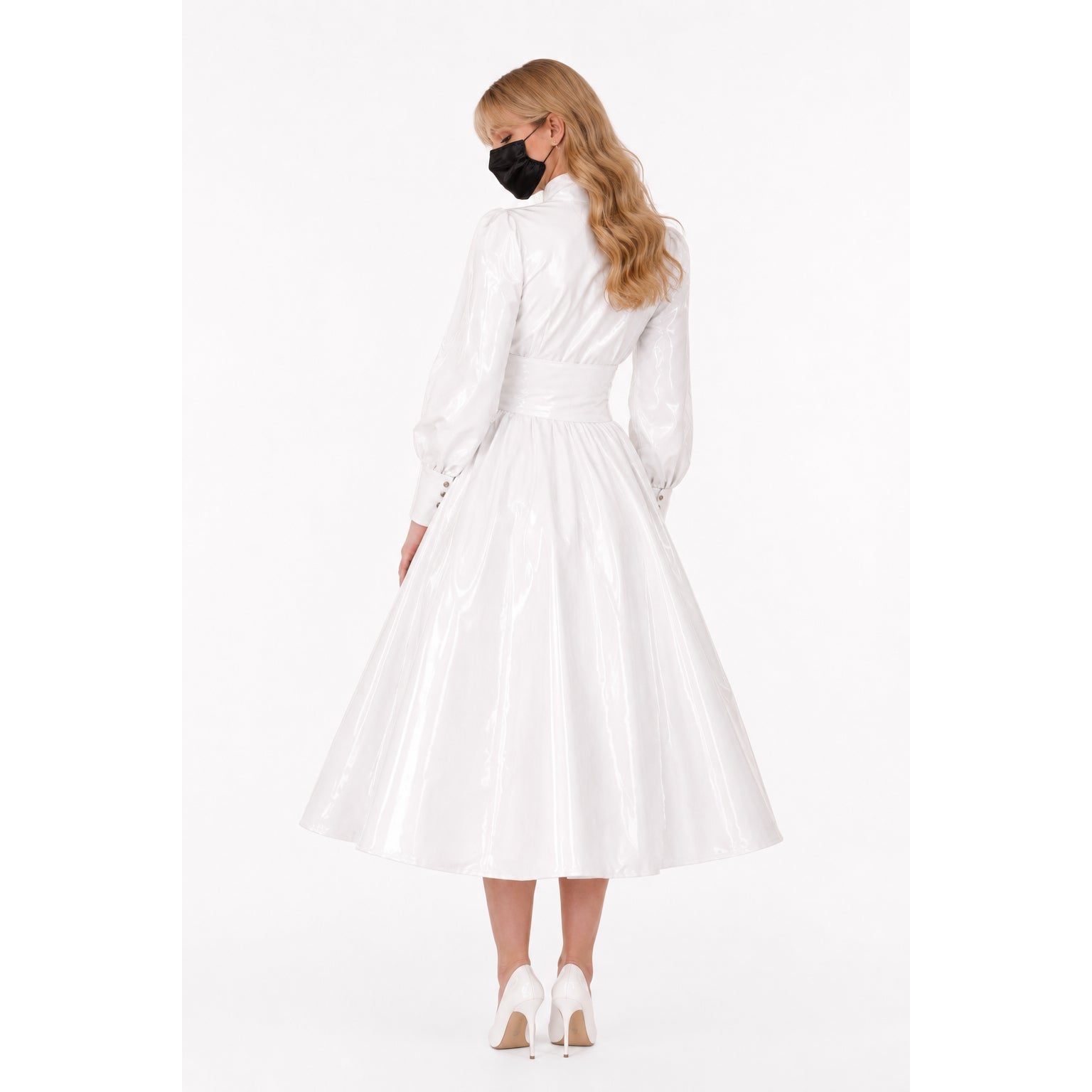 White PVC sissy maid dress with long sleeves, fitted waist, and flared skirt, shown from back