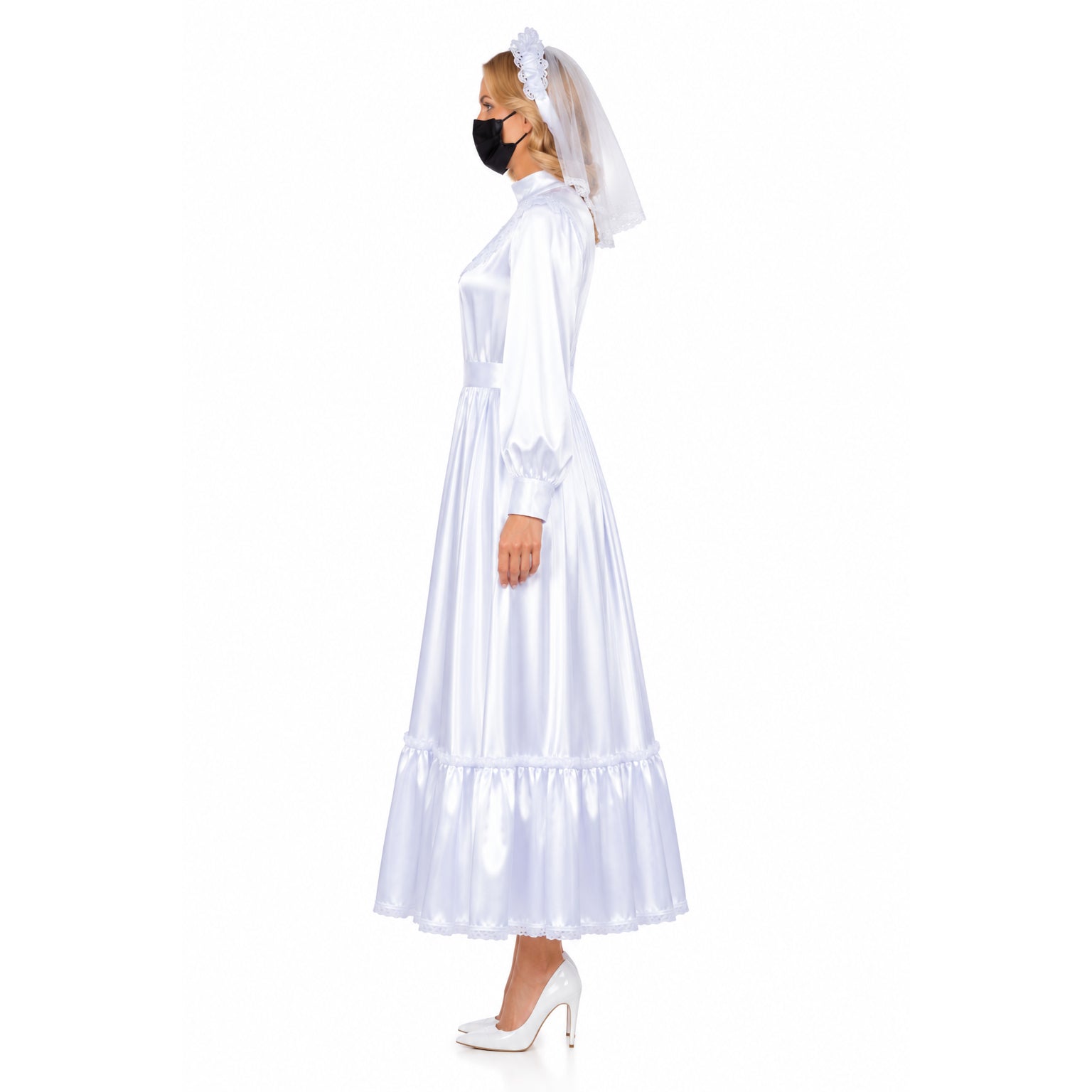 White sissy maid dress with lace trim, veil, and heels, side view