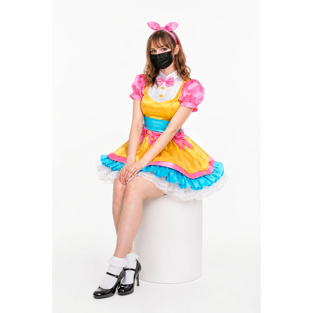 Sissy maid dress in yellow, pink, and blue with ruffles, bow, and headband, worn with heels and mask