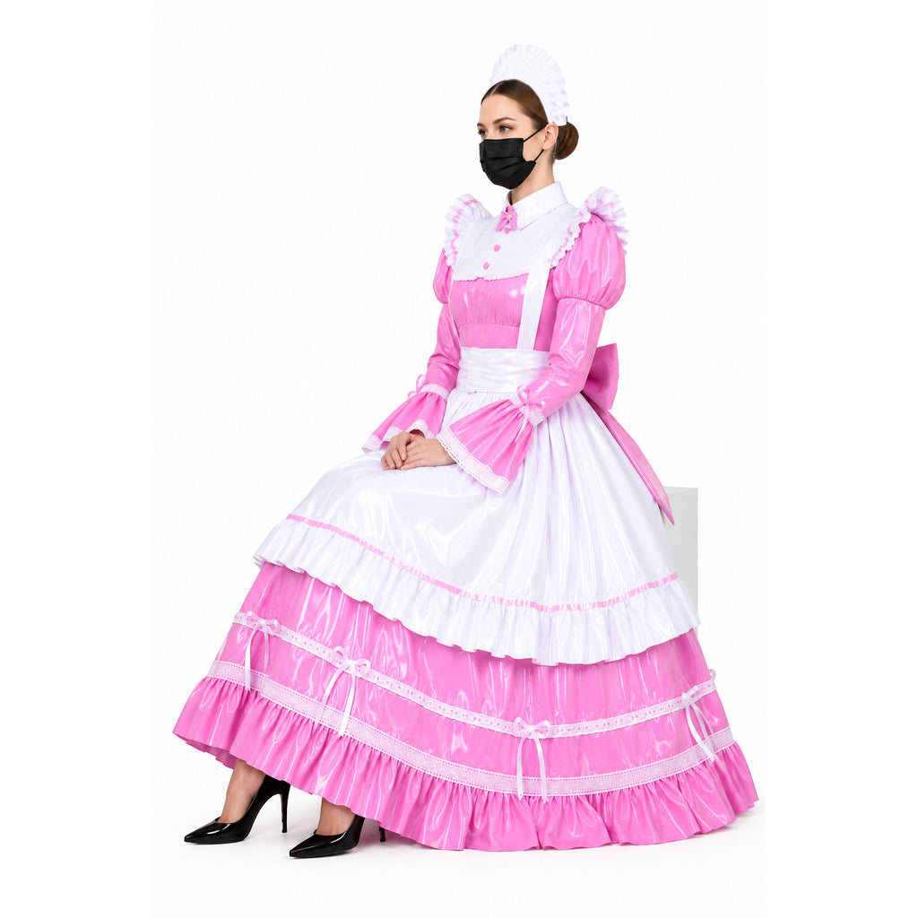 Pink and white sissy maid dress with ruffles, bow, and PVC finish, styled with black heels and mask