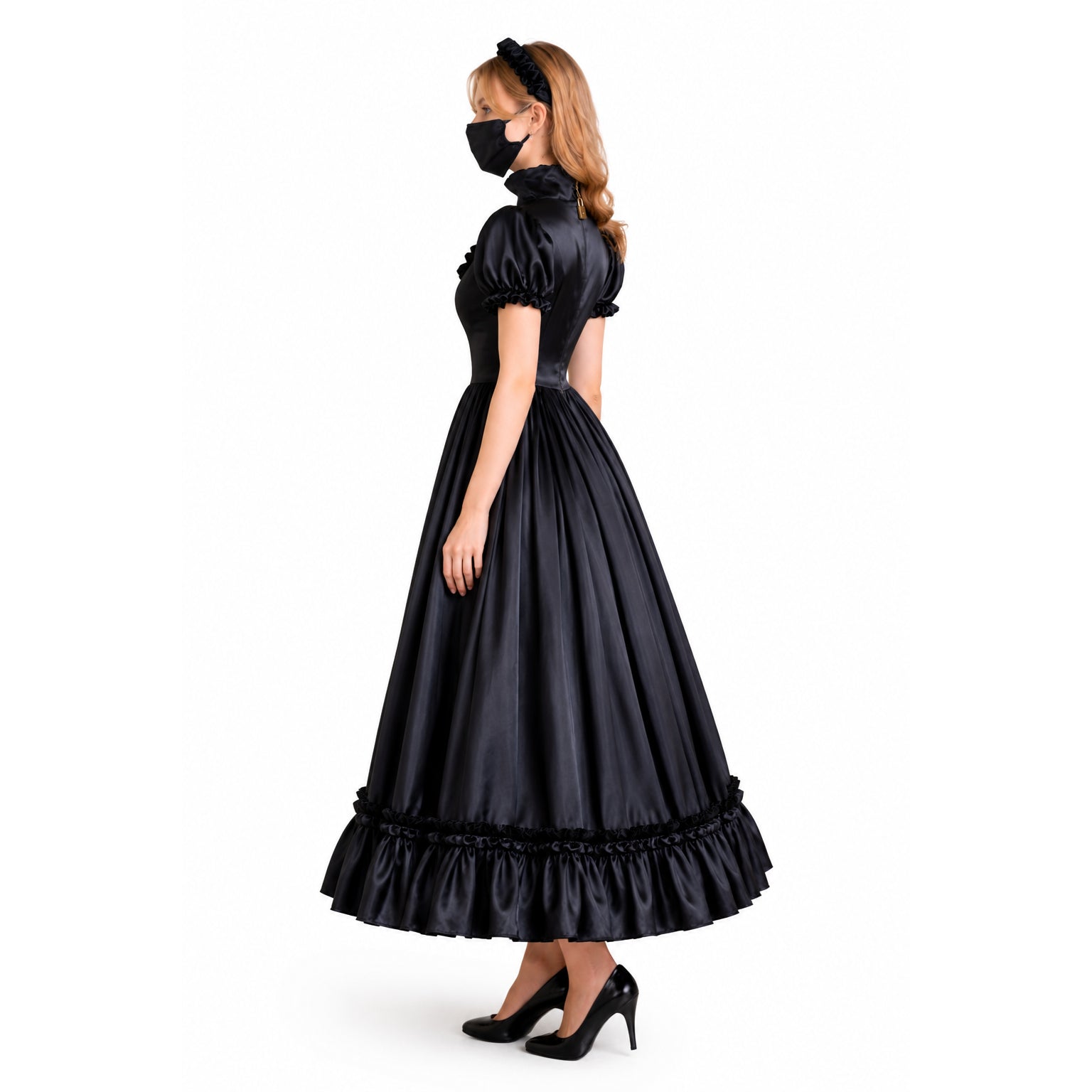 Black sissy maid dress with ruffled hem and puff sleeves, worn with heels and headband