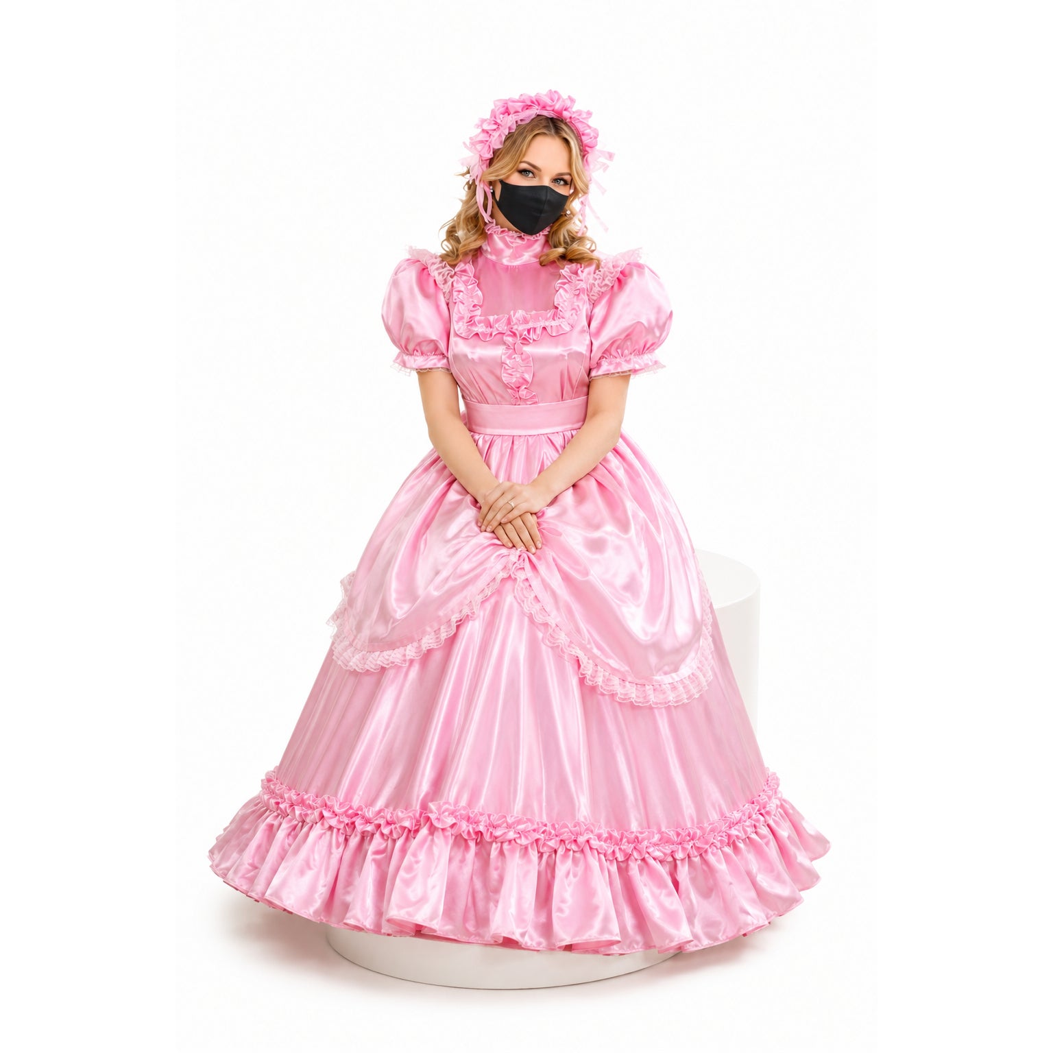 Pink sissy maid dress with ruffles, satin finish, and matching headpiece, styled for elegant costume fashion.