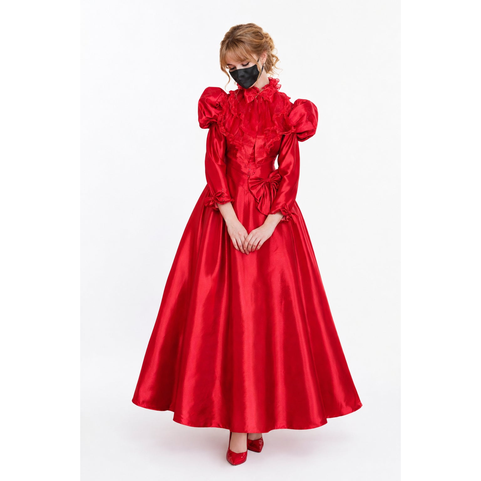 Red sissy maid dress with ruffles, puffed sleeves, and bow detail, worn with matching heels