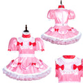 Pink sissy maid dress with red bows, puffed sleeves, and white ruffles on mannequin