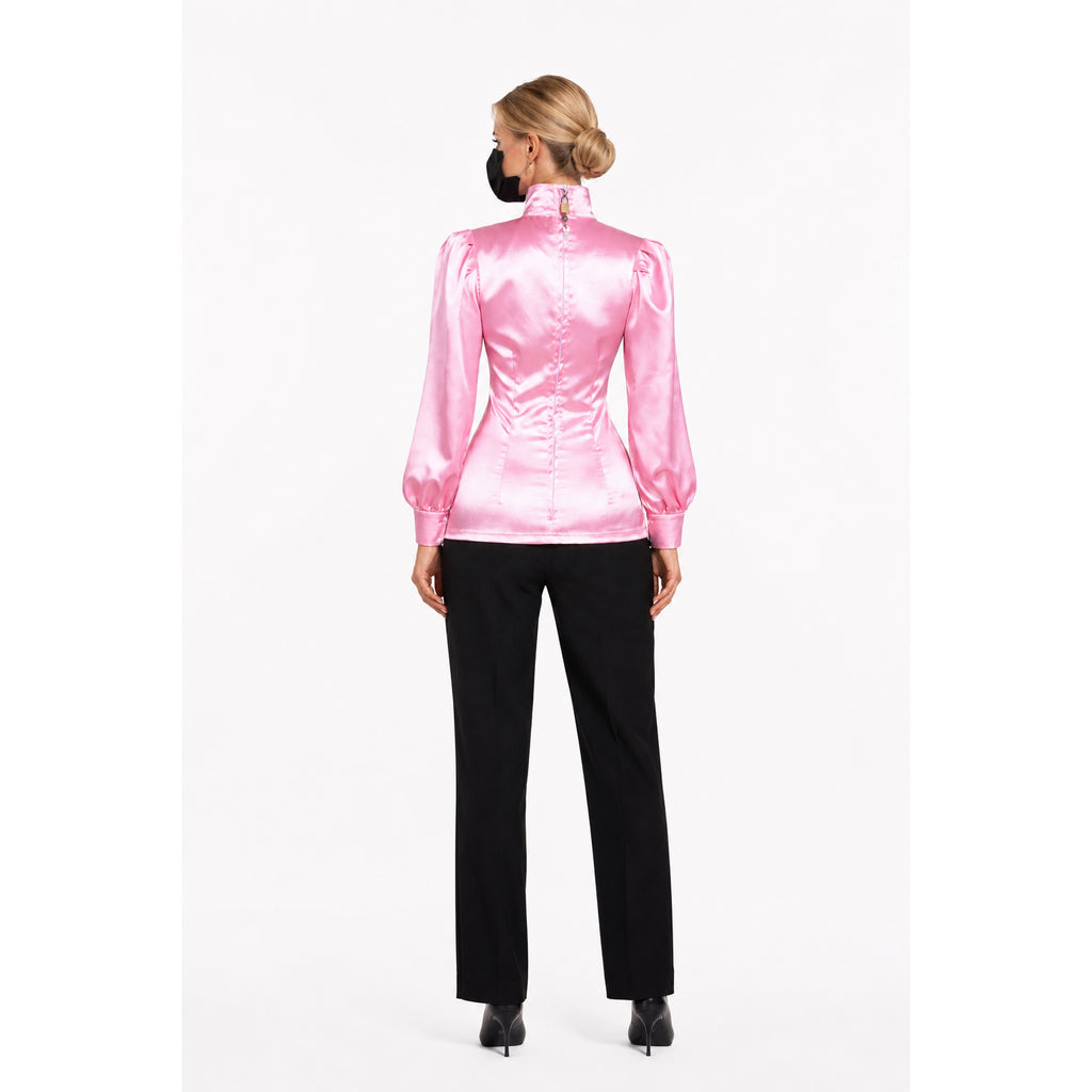 Pink satin sissy maid blouse with puff sleeves, back view, paired with black pants and heels