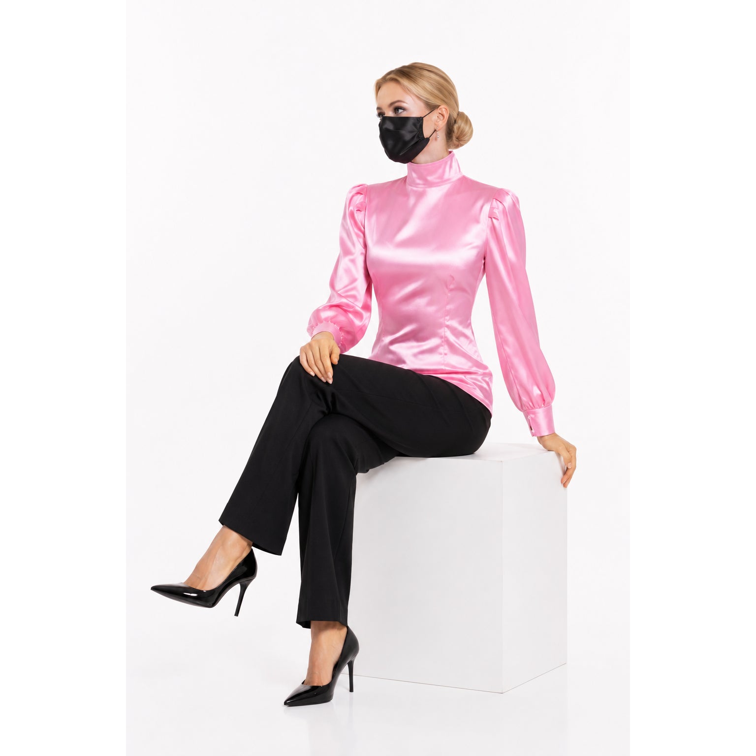 Pink satin blouse with puffed sleeves, black pants, and heels — sissy maid dress style