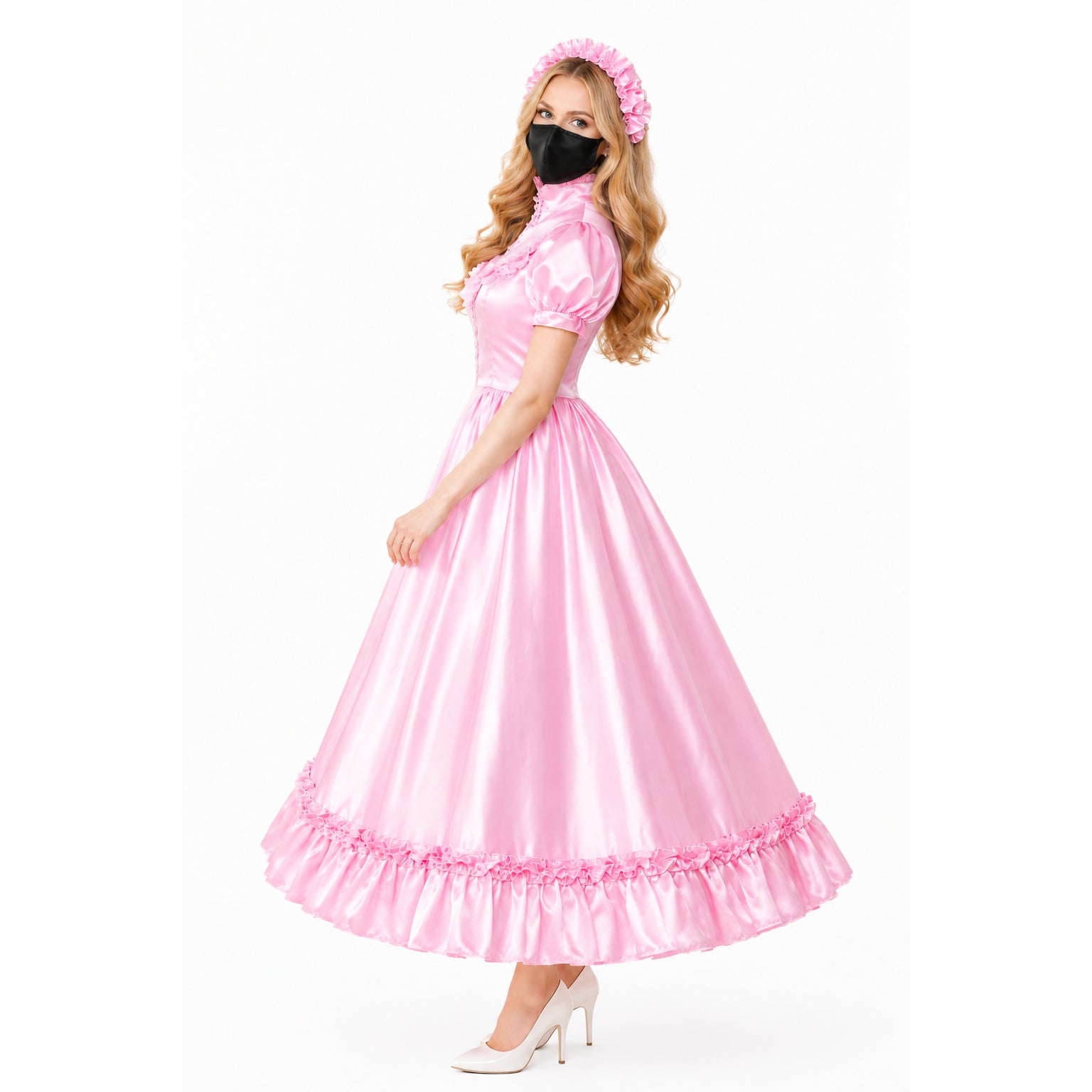 Pink sissy maid dress with ruffles, matching headband, and white heels on model