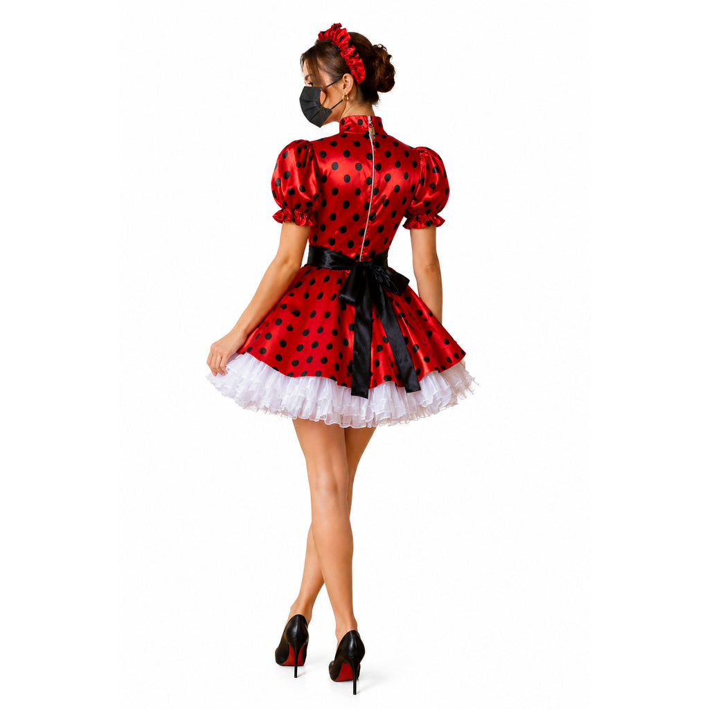 Red polka dot sissy maid dress with black bow, white ruffle hem, and puff sleeves, shown from back