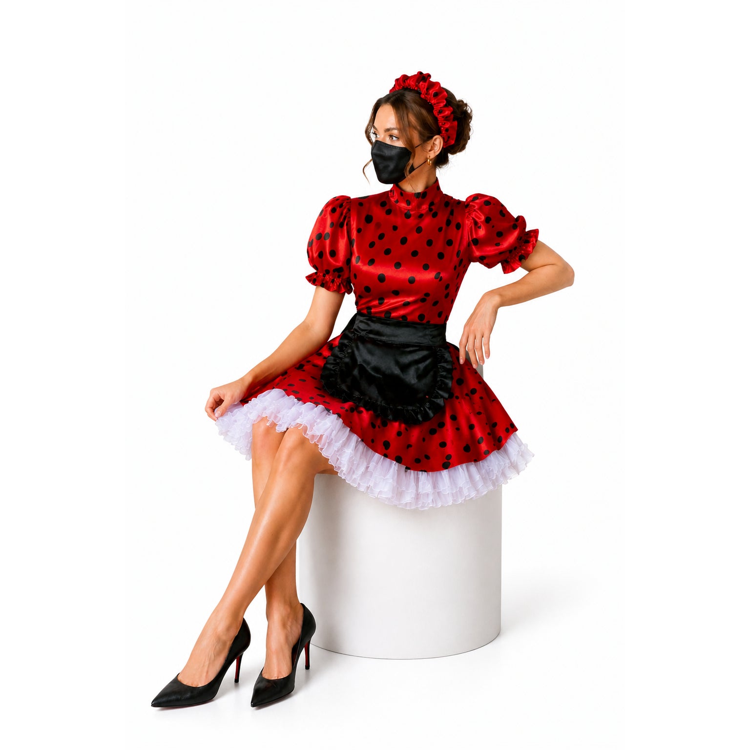 Red polka dot sissy maid dress with black apron, white ruffles, and matching headband, styled with heels.