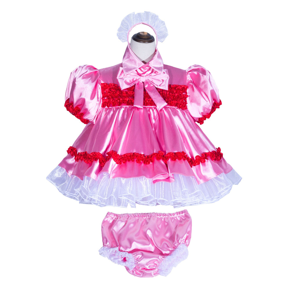 Pink sissy maid dress set with red ruffles, white petticoat, and matching panties