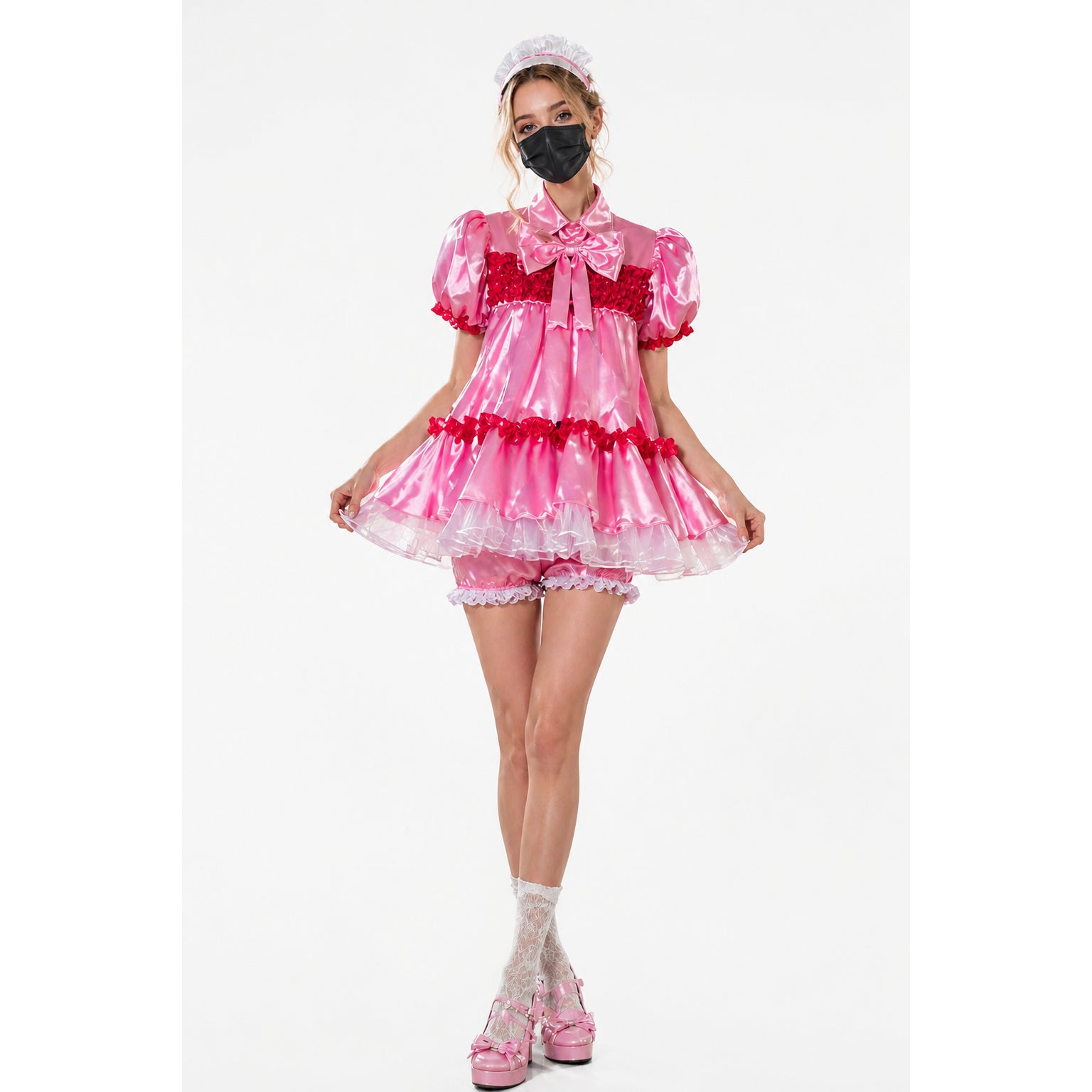 Pink sissy maid dress with red ruffles, satin bow, and matching panties, styled with lace socks and platform heels