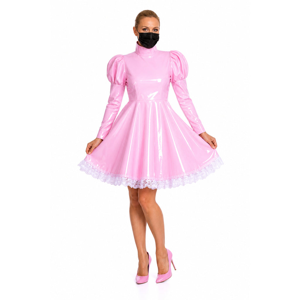 Pink PVC sissy maid dress with lace trim and puffed sleeves, paired with matching heels