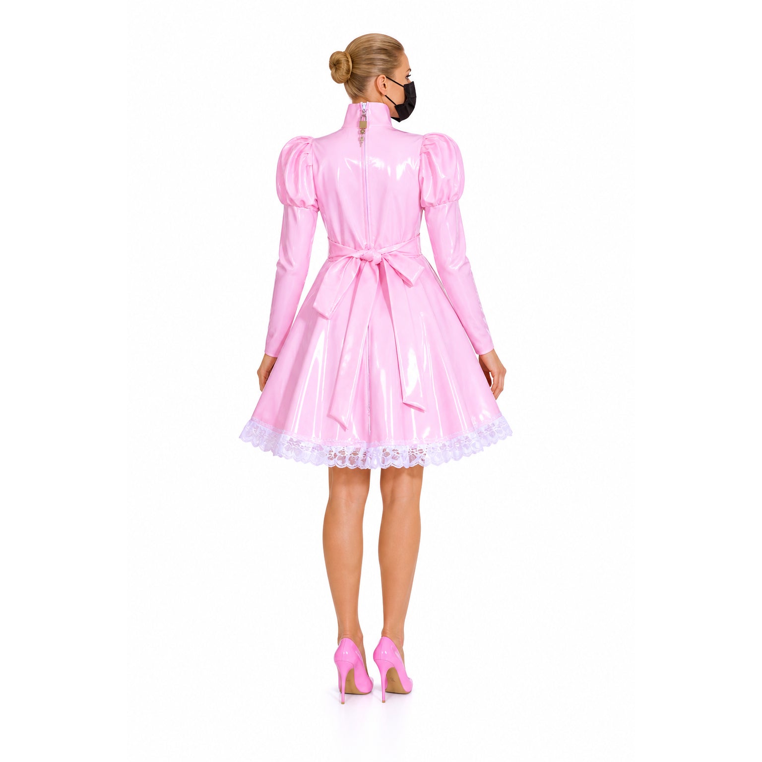 Pink sissy maid dress with lace trim and bow, paired with matching heels