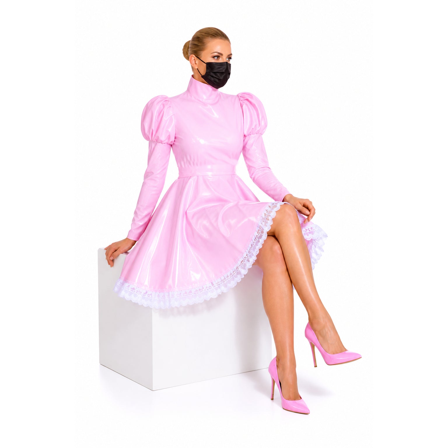 Pink PVC sissy maid dress with puffed sleeves, lace trim, and matching heels, styled for elegant fashion.