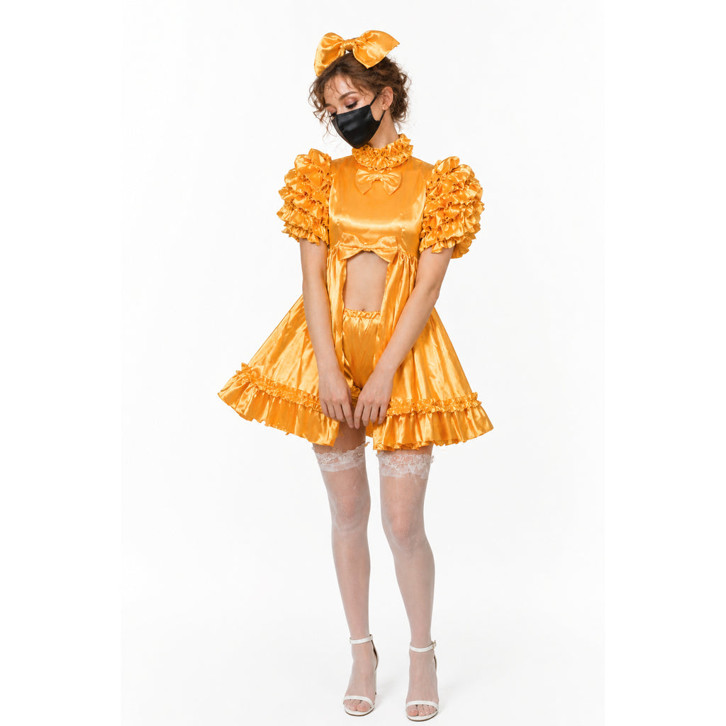Golden sissy maid dress with ruffles, bow, and matching headpiece, styled with lace stockings and heels