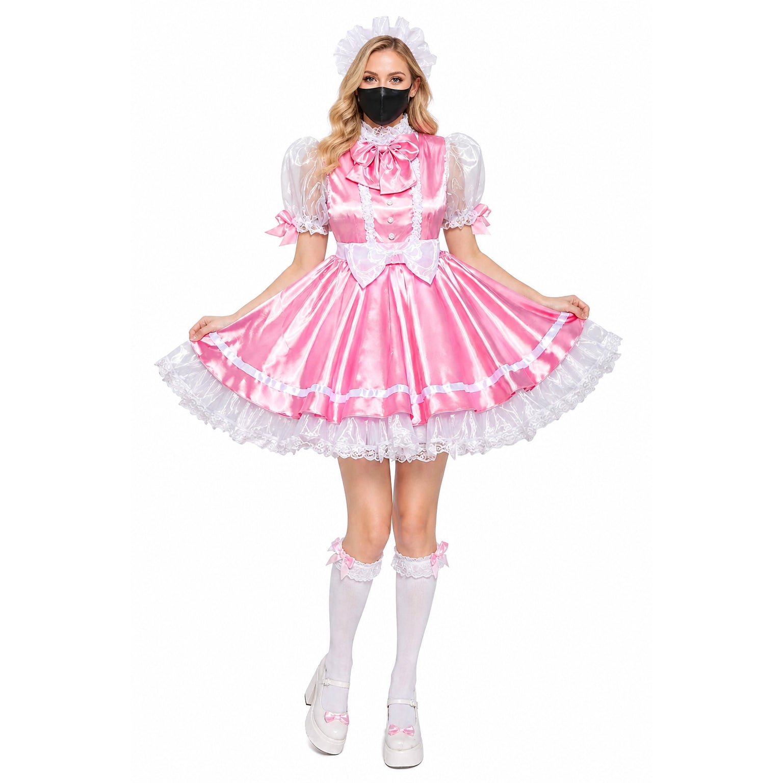 Pink sissy maid dress with white lace, puffy sleeves, and bow accents, paired with thigh-high stockings and platform shoes.