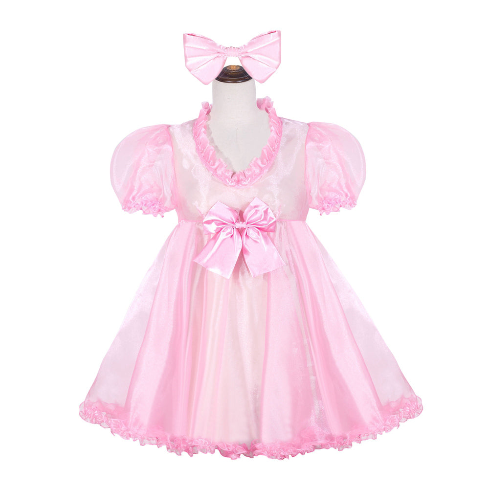 Pink sissy maid dress with ruffles, puff sleeves, and bow, displayed on mannequin with matching headband