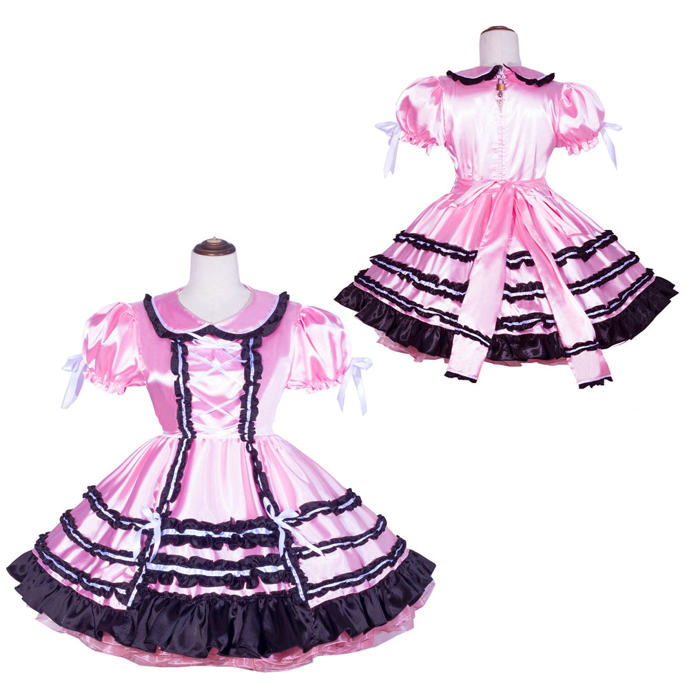 Pink sissy maid dress with black trim, puffed sleeves, and ruffled skirt on mannequin