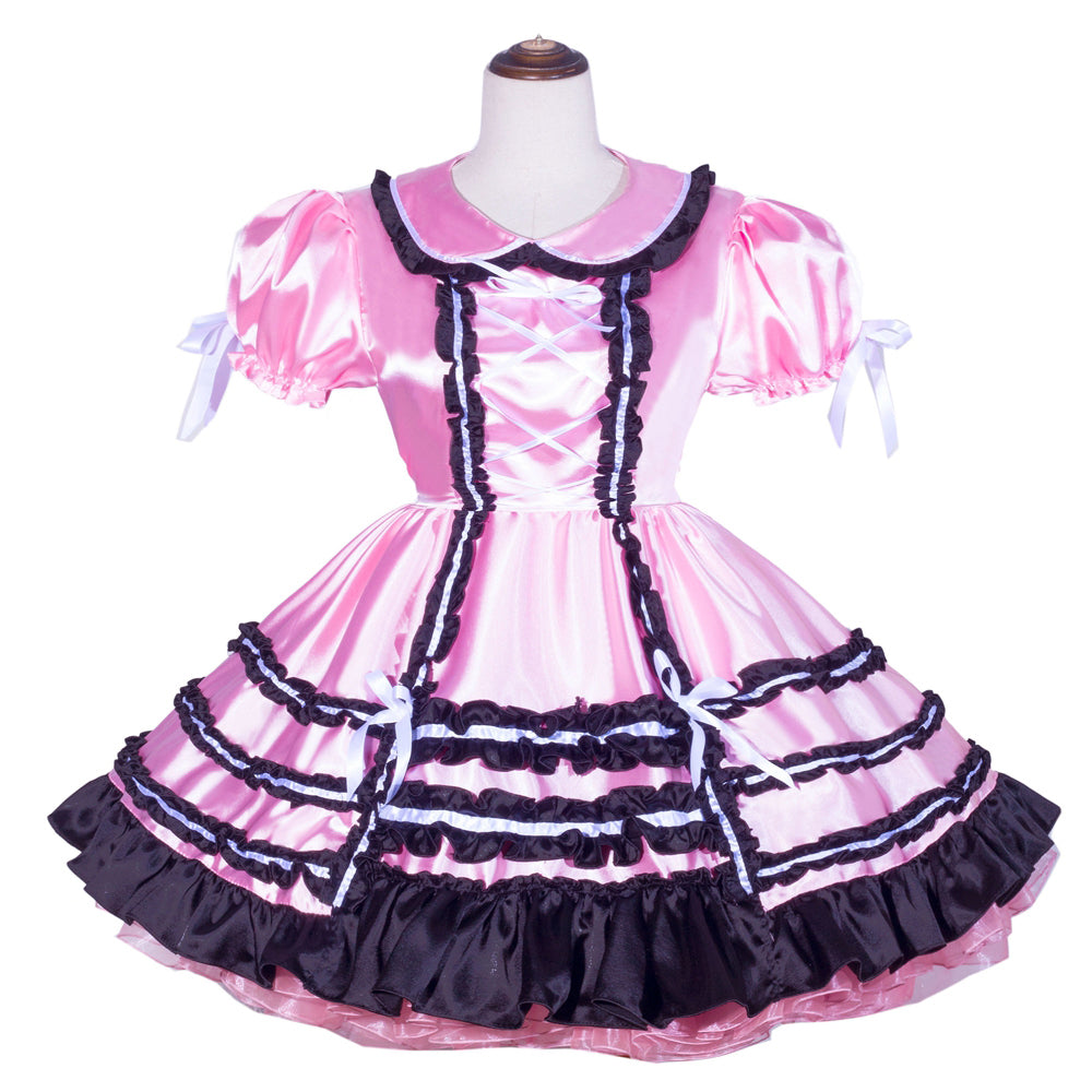 Pink sissy maid dress with black ruffles and white bows, featuring puffed sleeves and lace-up front.