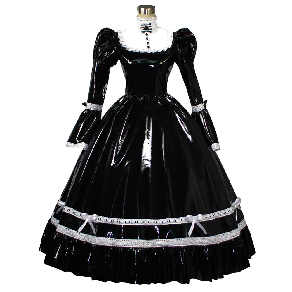Glossy black PVC sissy maid dress with puff sleeves and white lace details, full length Victorian maid fashion on a mature model sitting on a minimalist white cylinder